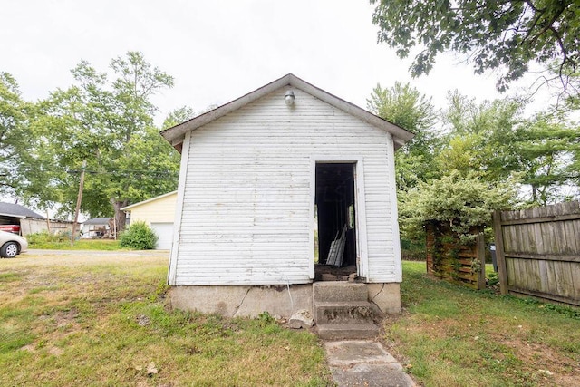 view of outdoor structure with a lawn