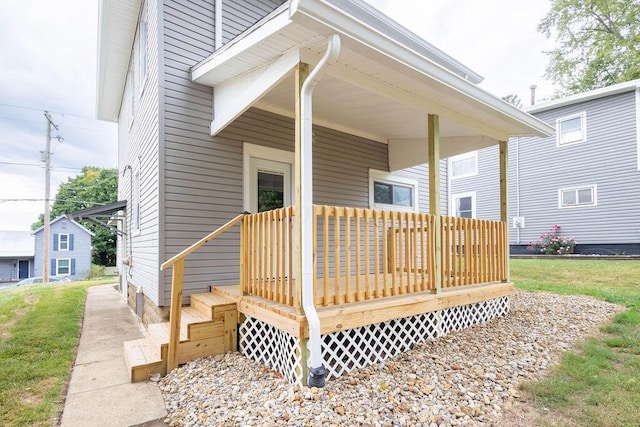 view of exterior entry featuring a deck