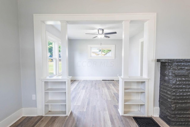 interior space featuring wood-type flooring and ceiling fan