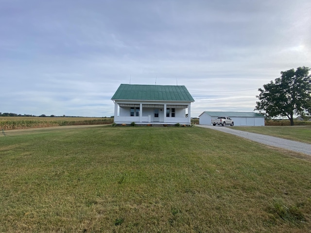 view of front facade featuring covered porch and a front yard