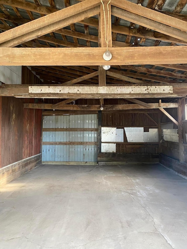 garage featuring wood walls