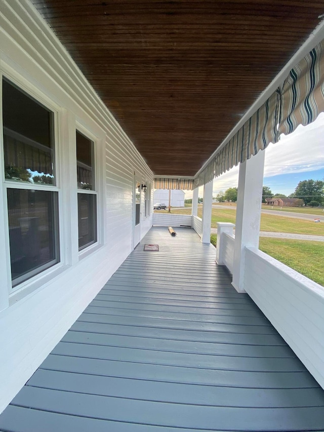 wooden terrace with covered porch