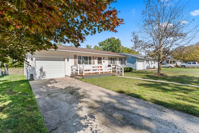 ranch-style house featuring a garage, covered porch, and a front lawn