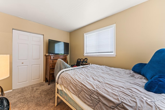 bedroom featuring a closet and carpet