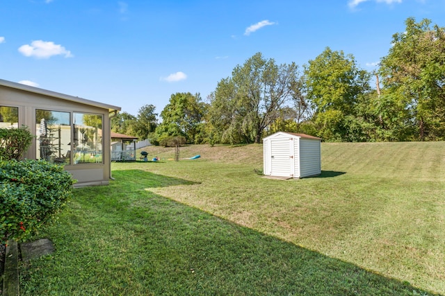 view of yard with a storage shed