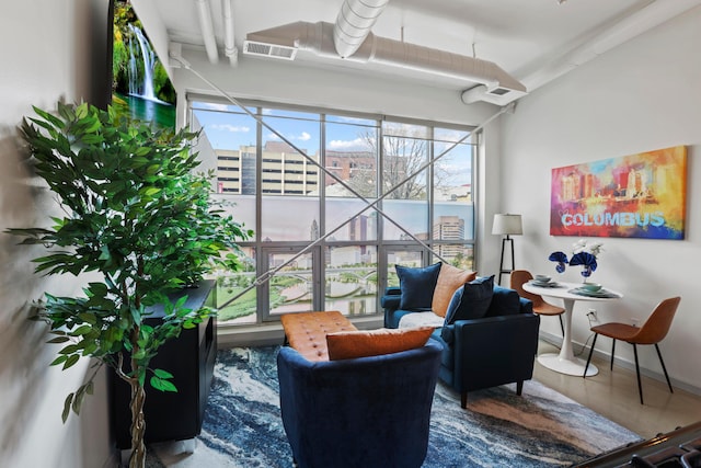 sitting room featuring a water view