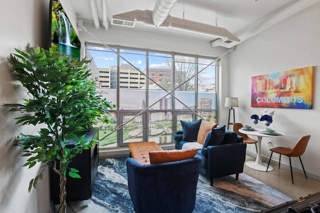 60 E Spring St Unit 105, Columbus, OH 43215 - sitting room featuring baseboards and a city view