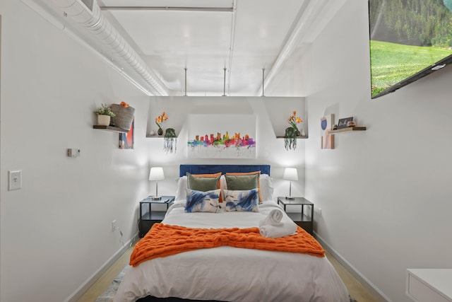 60 E Spring St Unit 105, Columbus, OH 43215 - bedroom with wood finished floors and baseboards