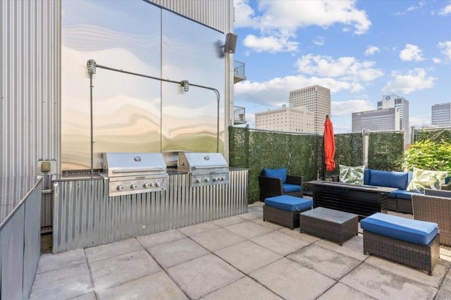 60 E Spring St Unit 105, Columbus, OH 43215 - view of patio / terrace with an outdoor living space, exterior kitchen, and a view of city