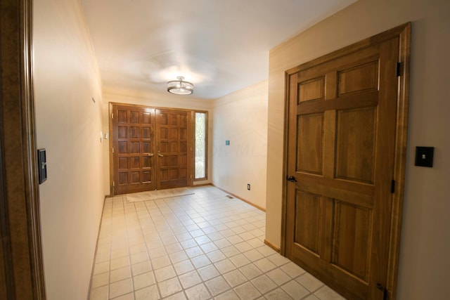 foyer entrance featuring light tile patterned floors