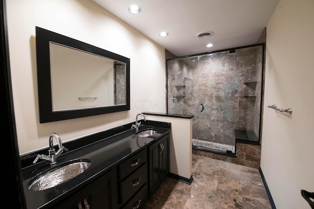 bathroom featuring vanity and an enclosed shower