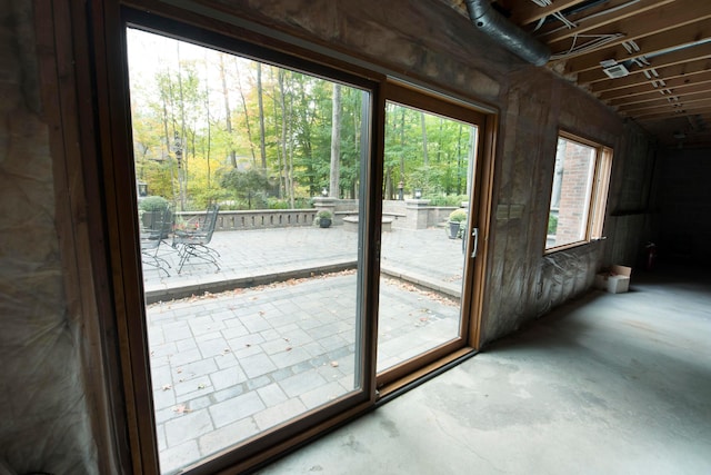 doorway with concrete floors