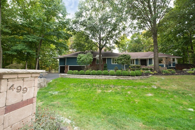 ranch-style home with a front yard