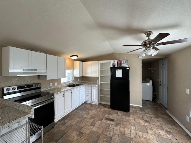 kitchen with white cabinetry, sink, black fridge, washer / dryer, and stainless steel range with electric cooktop