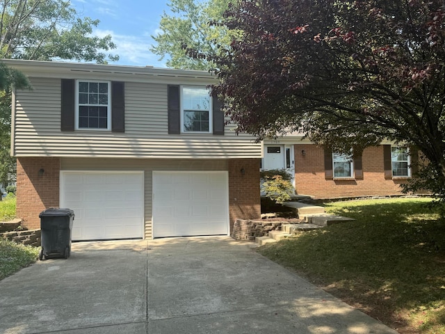 view of front of house featuring a garage and a front yard