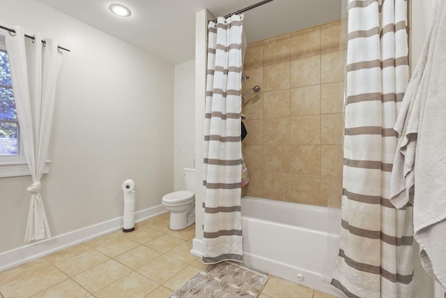 bathroom featuring tile patterned flooring, shower / bath combination with curtain, and toilet