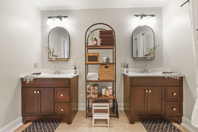 bathroom with tile patterned flooring and vanity