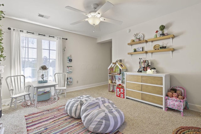 game room with light carpet and ceiling fan