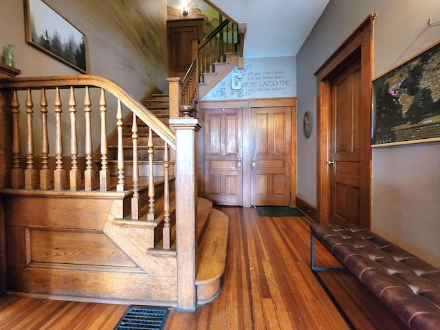 foyer entrance featuring dark hardwood / wood-style floors