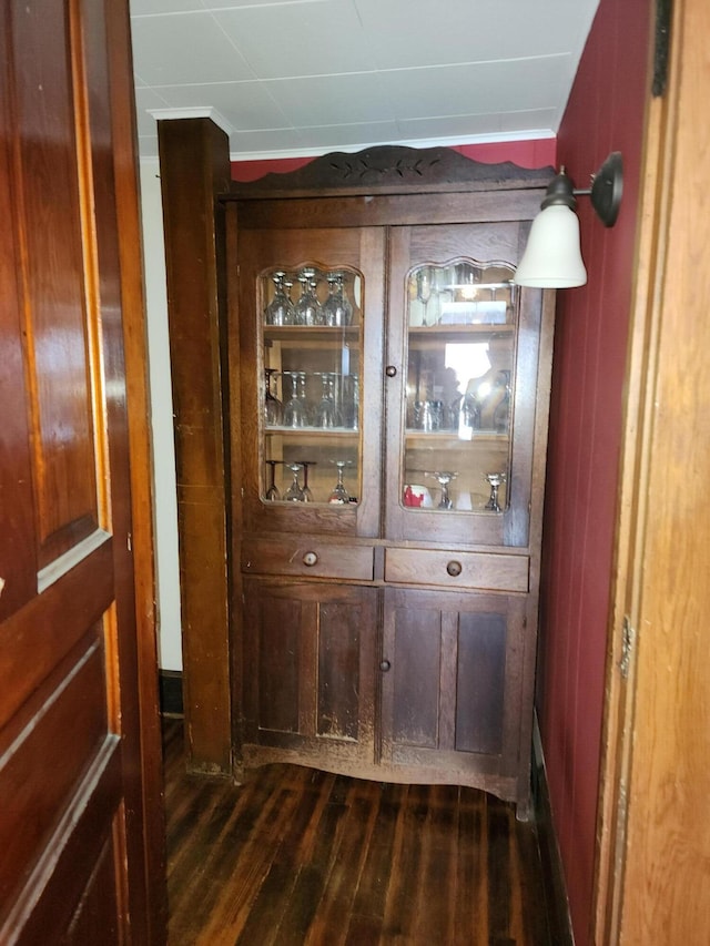 bar featuring dark wood-type flooring