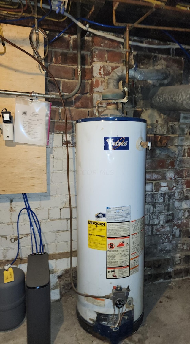 utility room featuring water heater