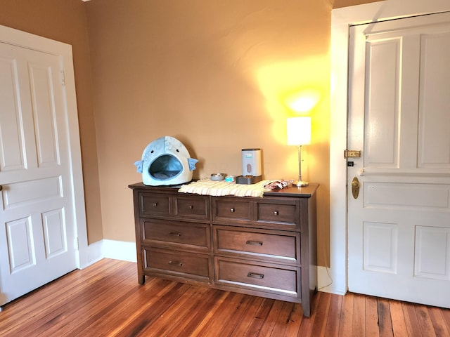 bedroom featuring dark wood-type flooring