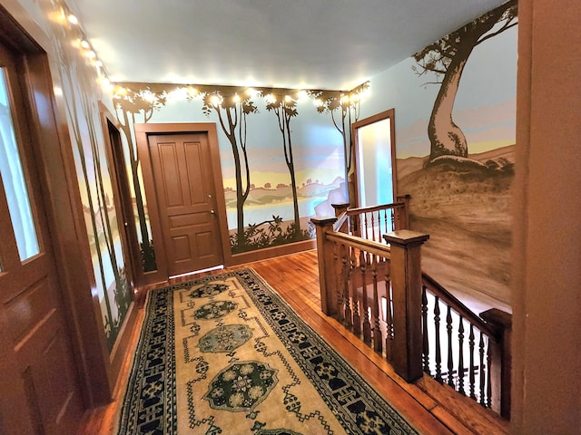 hall with hardwood / wood-style floors