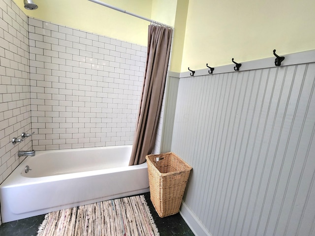 bathroom featuring shower / bath combo with shower curtain