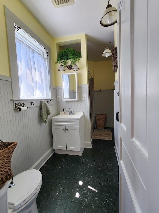 bathroom with vanity and toilet