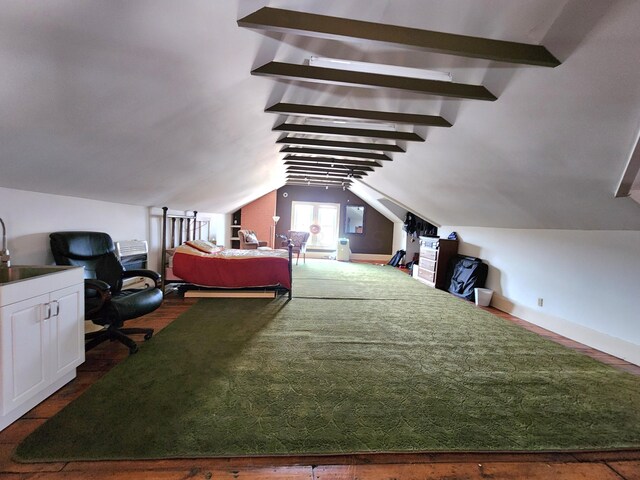 bedroom with lofted ceiling with beams