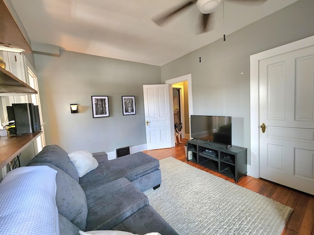 living room featuring ceiling fan and hardwood / wood-style floors