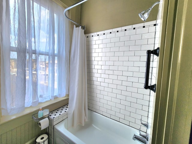 bathroom featuring shower / bath combo with shower curtain