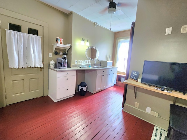 office with crown molding, sink, ceiling fan, and wood-type flooring