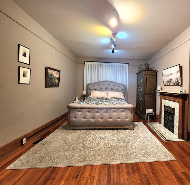 bedroom featuring dark wood-type flooring