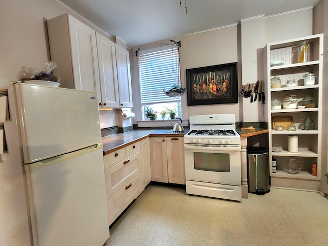 kitchen with white cabinets and white appliances