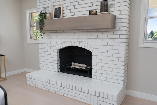 details featuring a fireplace and hardwood / wood-style floors