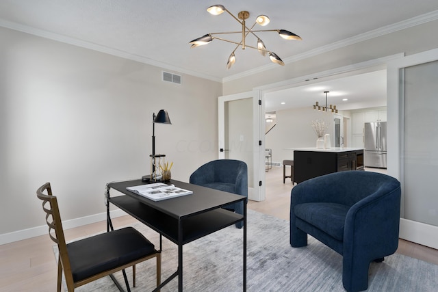 living room featuring light hardwood / wood-style floors, crown molding, and a chandelier