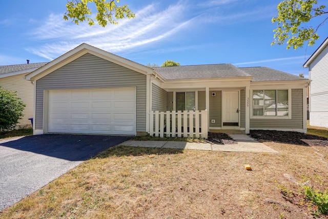 ranch-style home featuring a garage