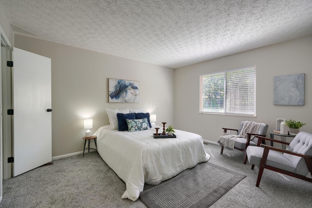 carpeted bedroom with a textured ceiling