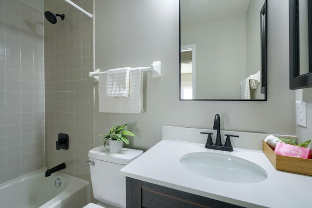 full bathroom featuring vanity, tiled shower / bath combo, and toilet