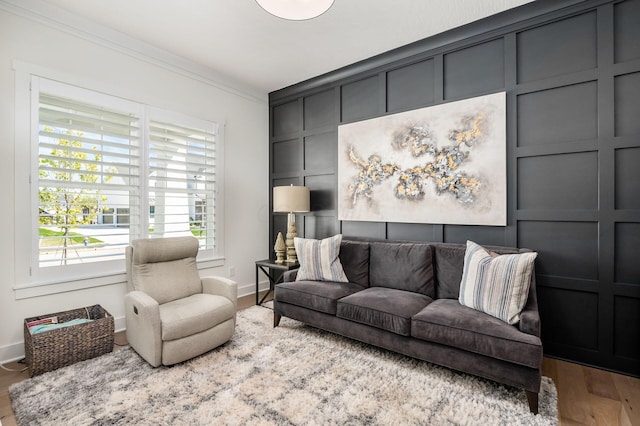 living room featuring crown molding and wood-type flooring