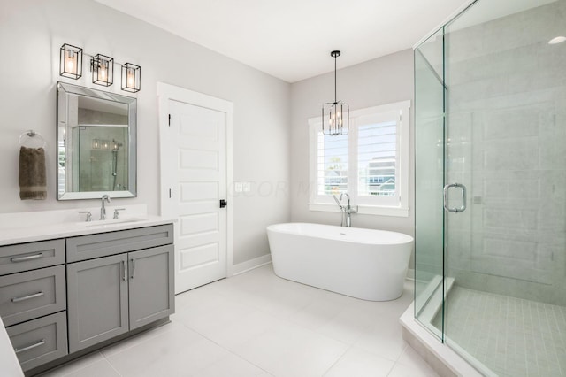 bathroom with vanity, tile patterned floors, and separate shower and tub