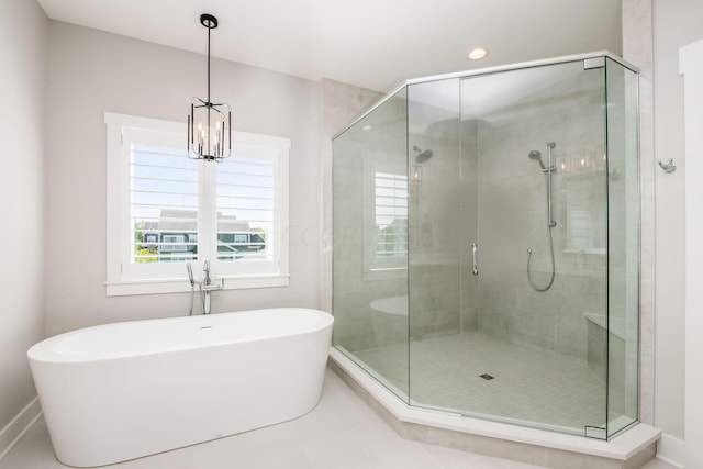 bathroom featuring tile patterned floors and shower with separate bathtub