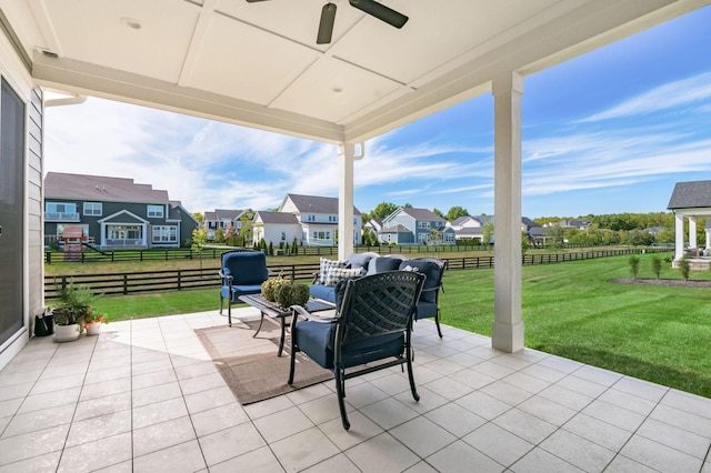 view of patio featuring ceiling fan