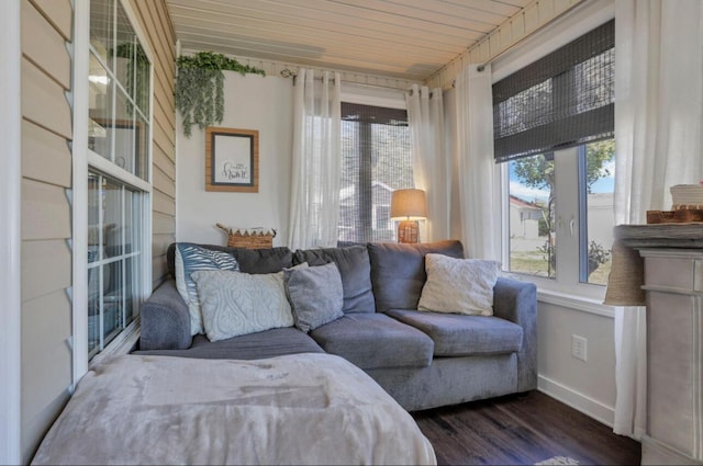 interior space with dark wood-type flooring and baseboards