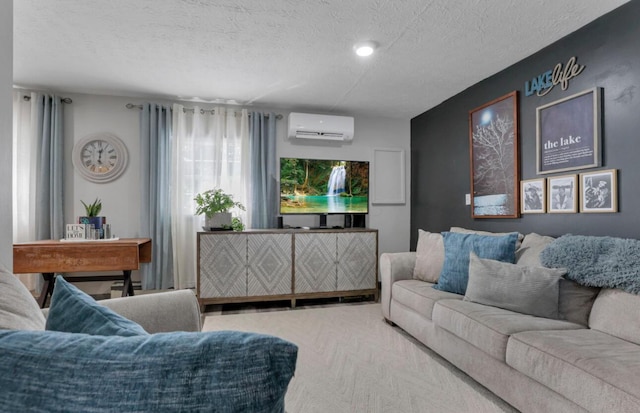 living area with carpet, a textured ceiling, and a wall mounted AC