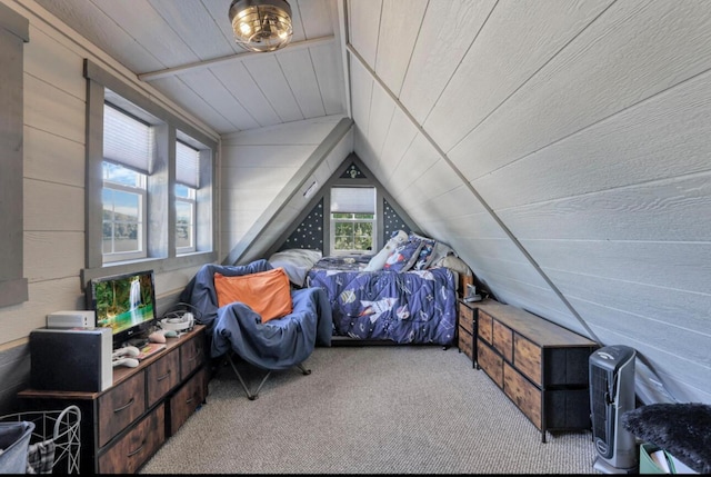 carpeted bedroom with lofted ceiling, wood walls, and wood ceiling