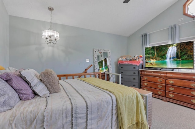 carpeted bedroom with lofted ceiling and an inviting chandelier