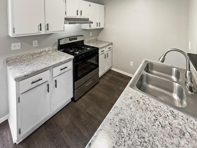 kitchen with dark hardwood / wood-style flooring, white cabinetry, stainless steel gas stove, and sink