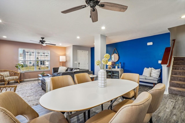 dining room with ceiling fan, wood-type flooring, and a textured ceiling